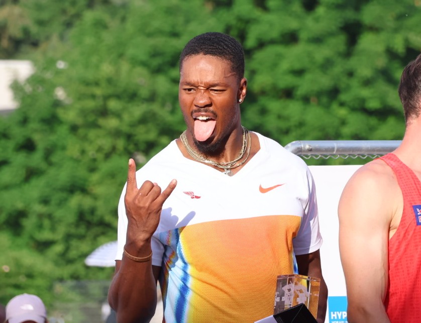 Kyle Garland sticking his tongue out on the podium in Goetzis